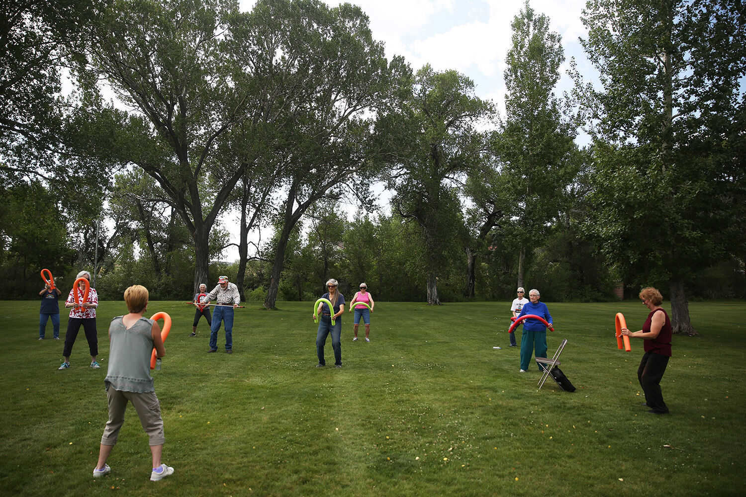 Attendees of the senior workout used pool noodles for their Friday morning workout